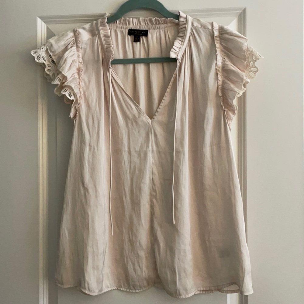 Cream top with ruffled sleeves